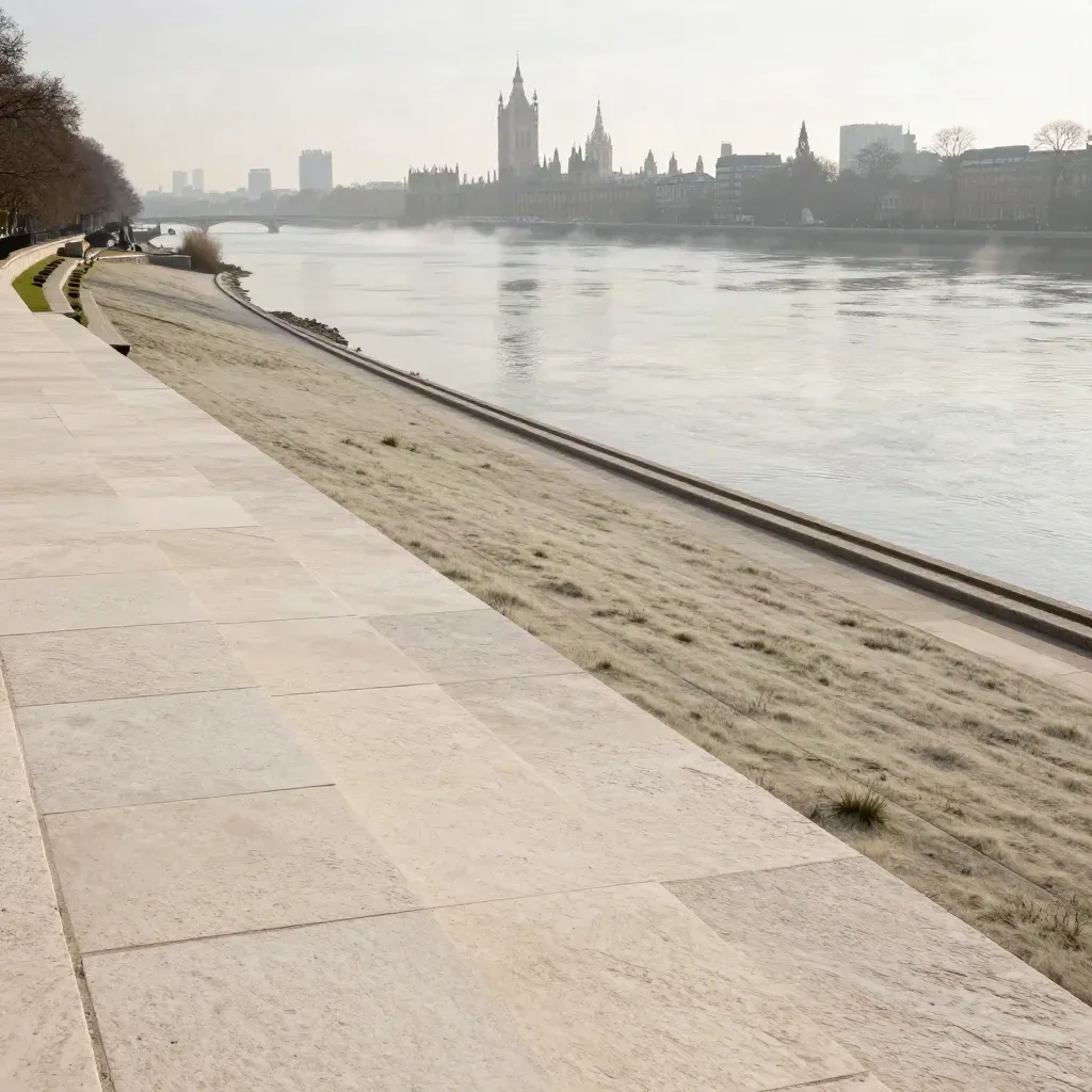 Mist over the Thames with Westminster skyline above a quiet riverside park and pale stone terrace.
